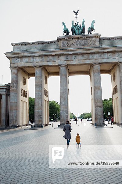 Mother and son walking in Berlin in Corona days.