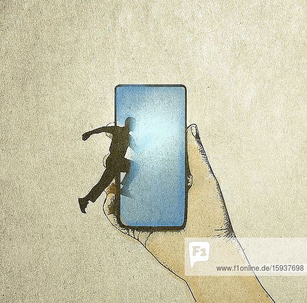 Mann springt in Smartphone-Bildschirm