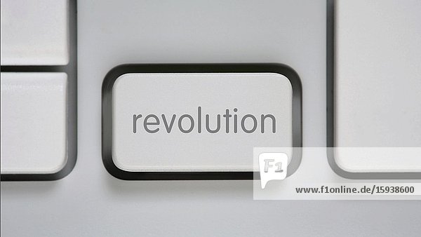 Computer Key with word 'Revolution' in Motion