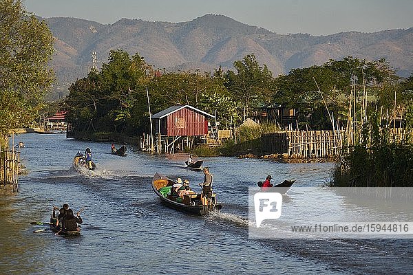 Boats in the main channel of the Intha pile village Inn Paw Khon  Inle Lake  Khan State  Myanmar  Asia