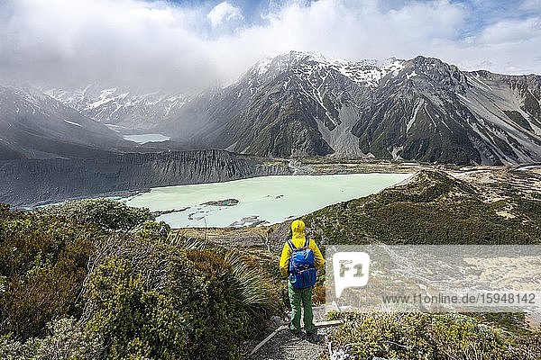 Hiker on trail  views of the Hooker Valley from the Sealy Tarns Track  glacial lakes Mueller Lake and Hooker Lake  Mount Cook National Park  Canterbury  South Island  New Zealand  Oceania