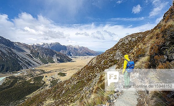 Hiker on trail  views of the Hooker Valley from the Sealy Tarns Track  Mount Cook National Park  Canterbury  South Island  New Zealand  Oceania