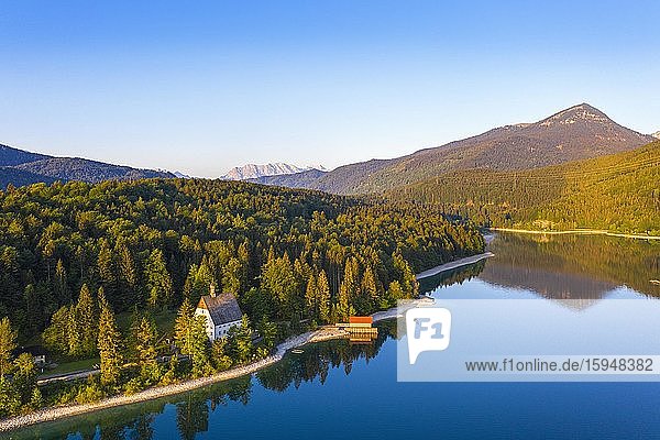 Walchensee with Klösterl and Simetsberg in the morning light  drone shot  Upper Bavaria  Bavaria  Germany  Europe
