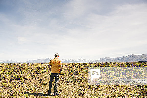 Rear view of man standing in remote landscape in Patagonia  Argentina