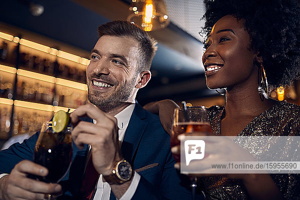 Happy couple socializing in a bar