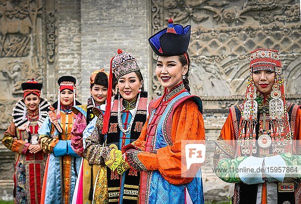 Young ladies are posing in Mongolian traditional costumes during the DEEL (national dress) festival  Ulaanbaatar capital city  Mongolia  Asia