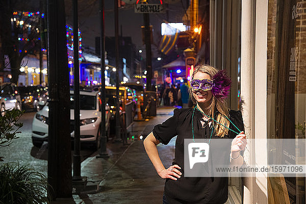 Woman ready to celebrate Mardis Gras on Frenchmen Street  the jazz district of New Orleans  Louisiana  United States of America  North America