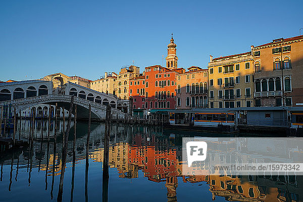 Reflections of the buildings and Rialto Bridge in the Grand Canal during Coronavirus lockdown  Venice  UNESCO World Heritage Site  Veneto  Italy  Europe