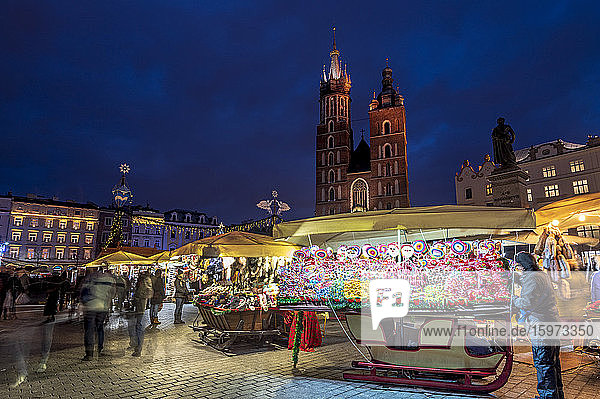 Christmas markets at night with Saint Mary's Basilica  Market Square  UNESCO World Heritage Site  Krakow  Poland  Europe