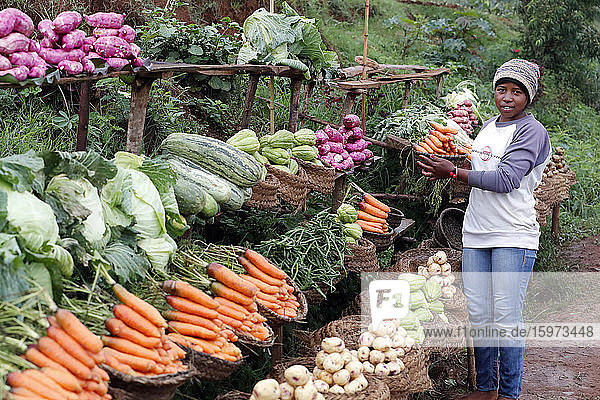 Woman selling fresh vegetables at market  Madagascar  Africa