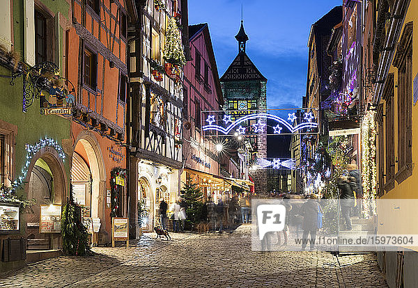 Rue du General de Gaulle covered in Christmas decorations illuminated at night  Riquewihr  Alsace  France  Europe