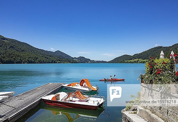 Pedal boats at the landing stage on the lake promenade  Fuschlsee  Fuschl am See  Salzkammergut  Province of Salzburg  Austria  Europe