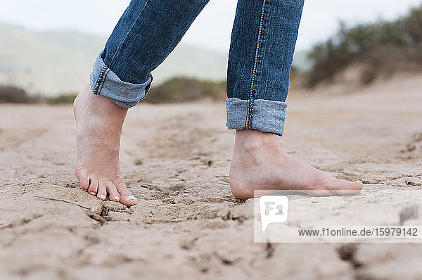 Woman's feet on dry soil  Sardinia  Italy