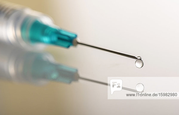 Liquid drop on top of syringe needle
