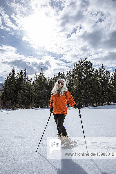 USA  Idaho  Sun Valley  Woman snowshoeing in winter landscape