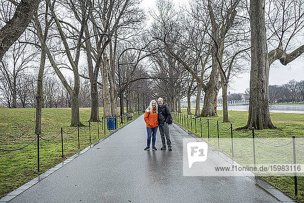 USA  Washington D.C.  Senior couple posing for photo in park
