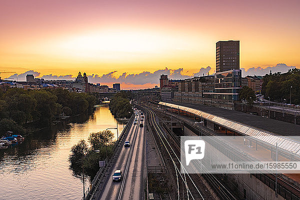 Sweden  Sodermanland  Stockholm  Cars passing tracks of Stockholm Central Station at sunset