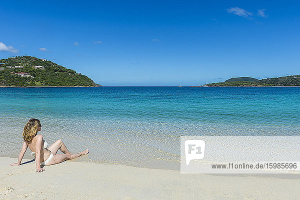 Woman wearing bikini relaxing at long bay beach  Beef island  British Virgin Islands