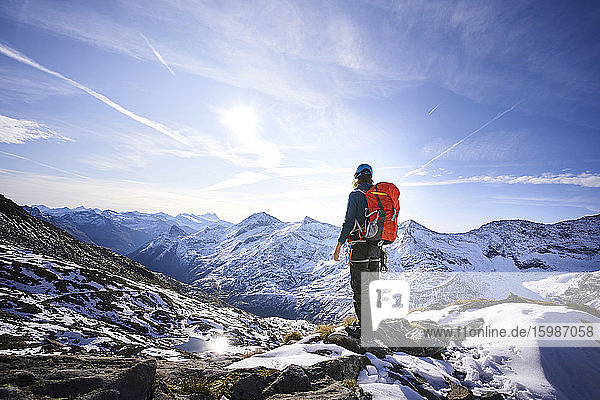 Female mountaineer with backpack on viewpoint  Glacier Grossvendediger  Tyrol  Austria