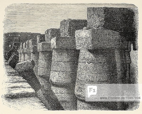 External wall of Karnak temple Egypt Africa. Old 19th century engraved illustration Le Tour du Monde 1863.