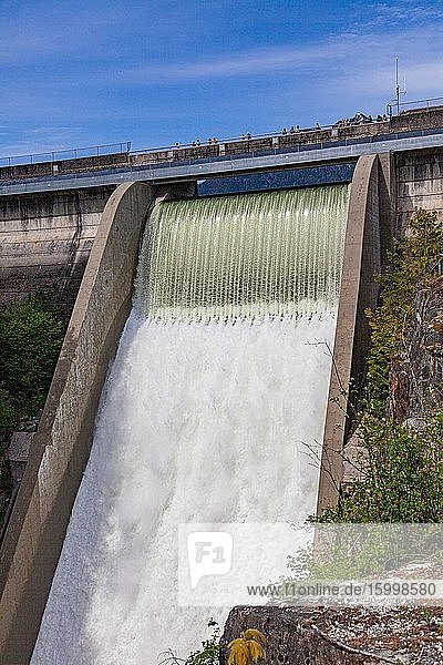 Spectators looking over the spillway at the Cleveland Dam in North Vancouver Canada.