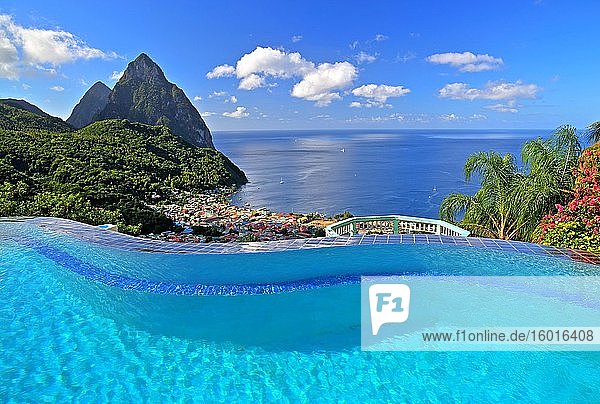 Swimming pool of the La Haut Resort with view of the village and the two Pitons Gros Piton 770m and Petit Piton 743m Soufriere St. Lucia Lesser Antilles West Indian Islands Caribbean Sea