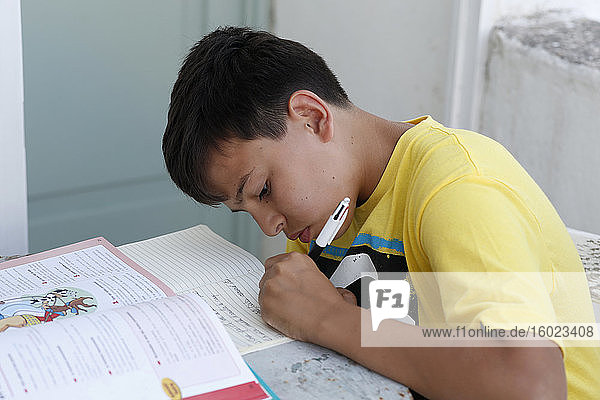 Teenager doing homework in salento  italy