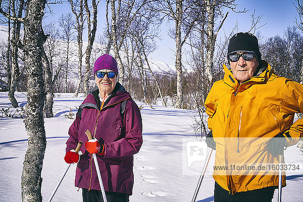 Couple cross-country skiing in Vasterbottens Lan  Sweden.