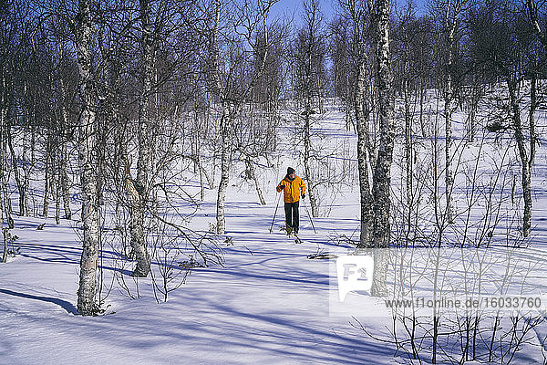 Man cross-country skiing in Vasterbottens Lan  Sweden. - -