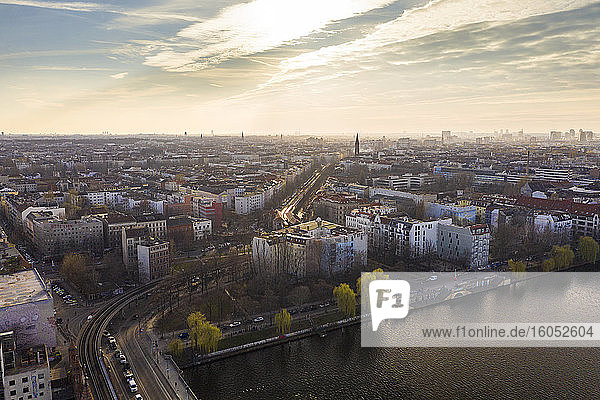 Germany  Berlin  Aerial view of Spree river canal and buildings of Kreuzberg district at dusk
