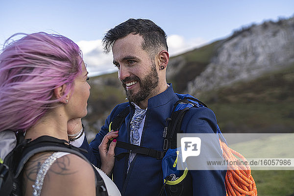 Bridal couple with climbing backpacks at Urkiola mountain  Spain