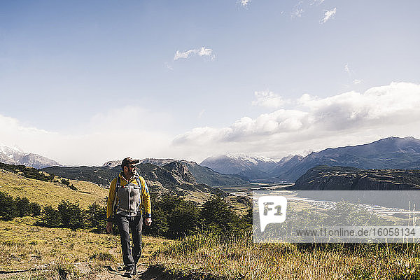 Man walking on landscape against sky at Patagonia  Argentina
