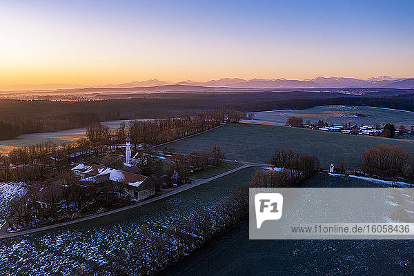 Germany  Bavaria  Dietramszell  Drone view of countryside village at dawn