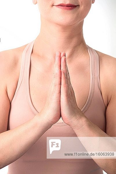 Hands folded yoga middle-aged women part features