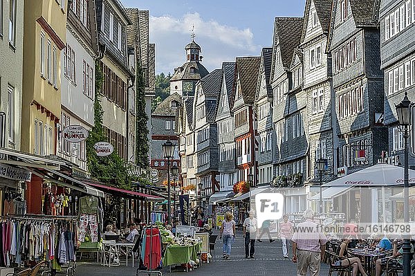 Shopping street with historic half-timbered houses  shops  cafés  restaurants  main street  old town  Herborn  Lahn-Dill district  Hesse  Germany  Europe