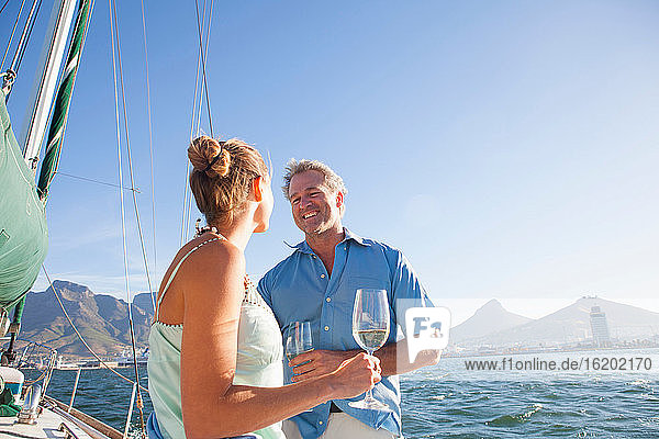 Couple on yacht with wine
