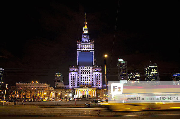 The Palace of Culture and Science illuminated at night  Warsaw  Poland