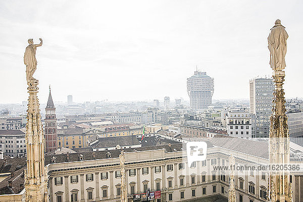 View looking out from above the Duomo, rooftop, Milan, Italy
