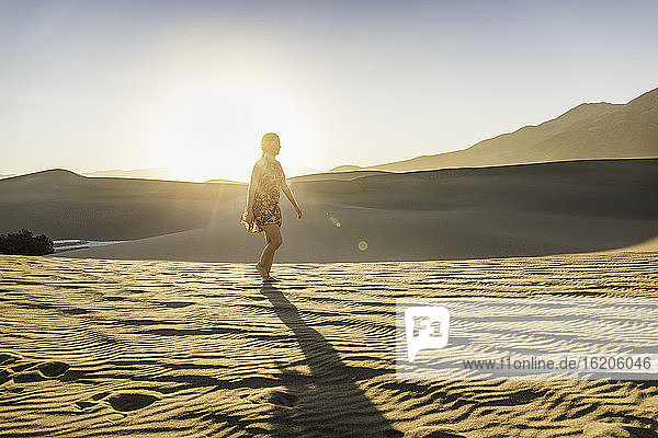 Woman walking alone  Mesquite Flat Sand Dunes  Death Valley National Park  Furnace Creek  California  USA