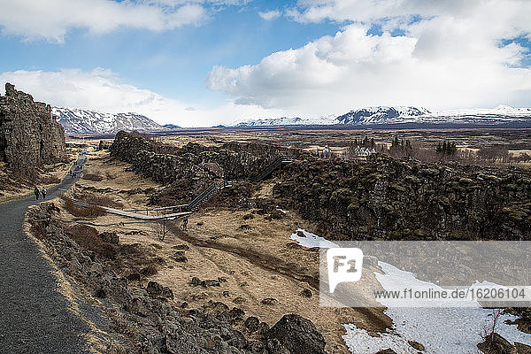 Elevated view of rugged landscape and distant snow capped mountain  Thingvellir National Park  Iceland