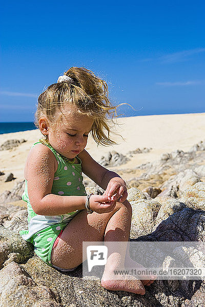 3 year old girl playing on beach  Cabo San Lucas  Mexico