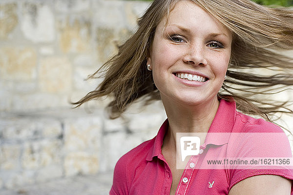 Young woman with windswept hair
