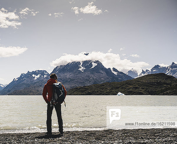 Backpacker admiring view of Grey Glacier in Torres Del Paine National Park  Chile  Patagonia  South America