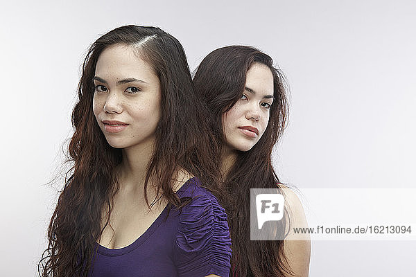 Portrait of young twin sisters