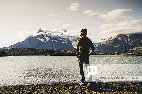 Man standing by lake Pehoe in Torres Del Paine National Park  Chile Patagonia  South America