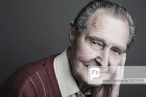 Portrait of senior man smiling  close up
