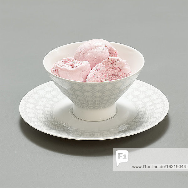 Three scoops of strawberry ice cream  close-up