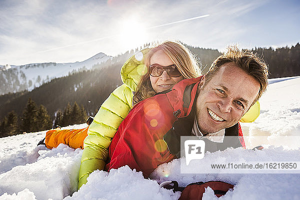 Couple cuddling in snow  Achenkirch  Austria