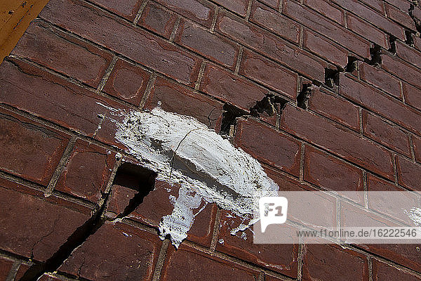 Crack tracking on a red brick building