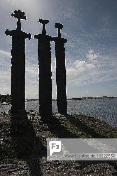 Three swords embedded into rock symbolizing Norway unification, Hafrsfjord, Norway